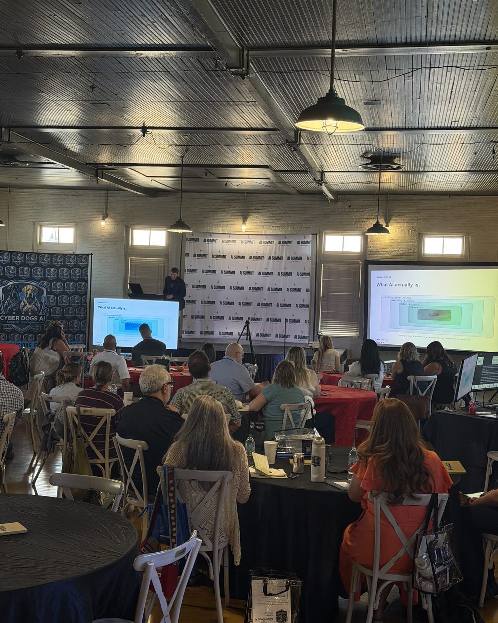 Attendees working through an exercise at round tables